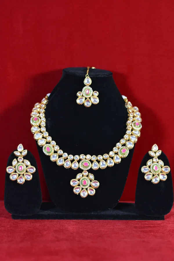 Gold_Kundan_Necklace_Set_With_Pink_Stone_Centerpieces_And_Earrings_(Pack_Of_4)