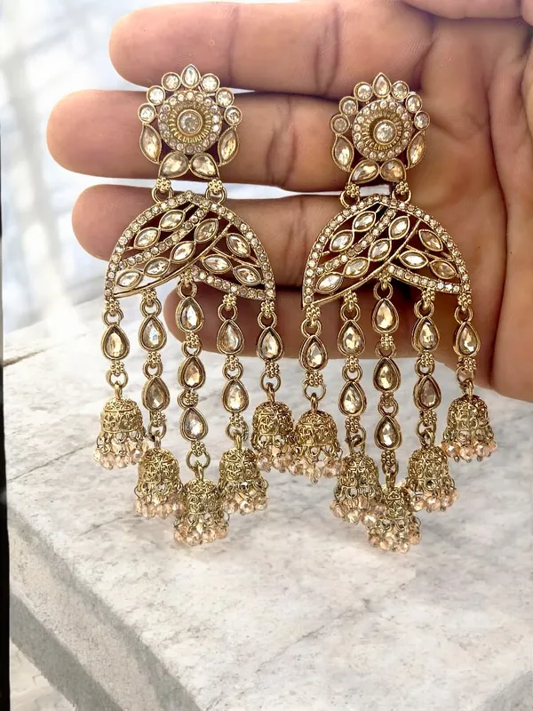 Gold-Toned_Kundan_&_Pearl_Studded_Crescent_Shaped_Jhumkas