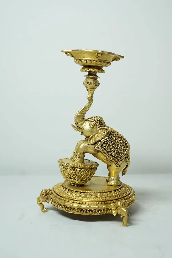 Rahadecor_Golden_Brass_Elephant_Diya_Stand_with_Peacock_-_Traditional_Dancing_Elephant_Oil_Lamp_-_14cm_Height_Weight-320grams