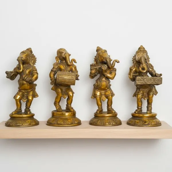 Golden_Premium_Brass_Musical_Ganesha_Set_6.765_Kg_-_H_20_Cm,_L_9_Cm,_B_7_Cm_-_Ganesh_Murti_With_Manjira_Murli_Dholak_Harmonium_Statue_For_Home_Temple_Decor_Gift