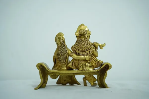 Golden_Radha_Krishna_Brass_Idol_Sitting_On_Bench_Decorative_Statue_Showpiece_Finish_15Cm_X_16Cm_weight_-1.3kg