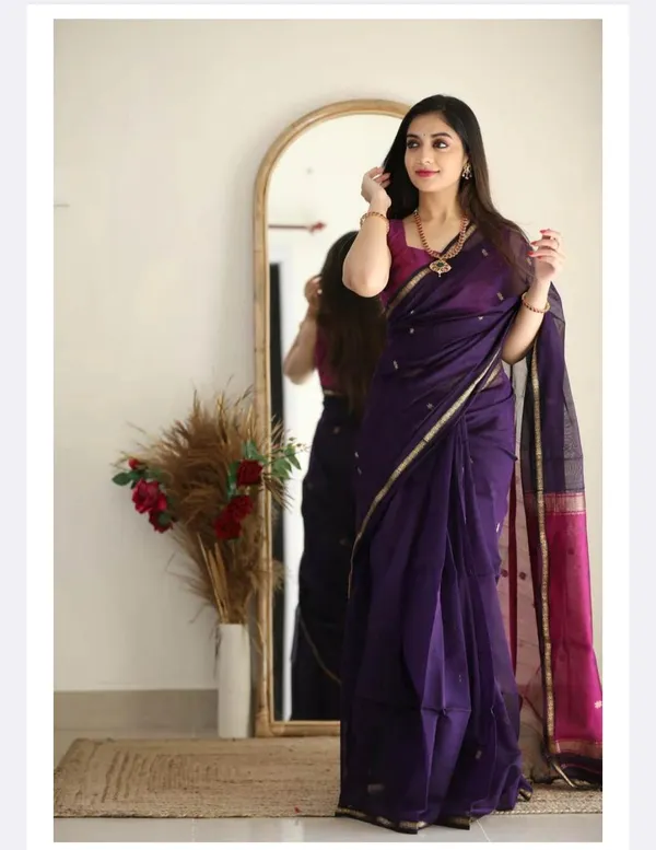 A_premium_Litchi_Silk_Saree_is_known_for_its_soft_texture,_rich_sheen,_lightweight_drape,_and_elegant_woven_zari_patterns.