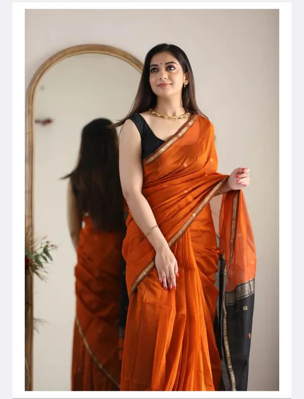 A_premium_Litchi_Silk_Saree_is_known_for_its_soft_texture,_rich_sheen,_lightweight_drape,_and_elegant_woven_zari_patterns.