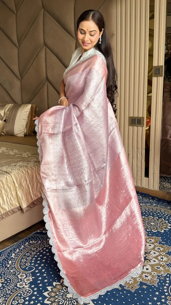 Grace_In_Every_Fold_A_Soft_Pastel_Pink_Saree_With_Shimmering_Silver_Shine_And_Delicate_Lace_Border_Perfect_For_Timeless_Elegance.