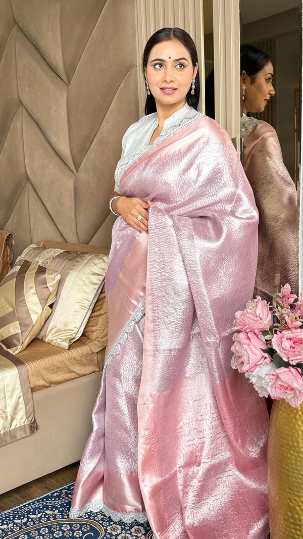 Grace_In_Every_Fold_A_Soft_Pastel_Pink_Saree_With_Shimmering_Silver_Shine_And_Delicate_Lace_Border_Perfect_For_Timeless_Elegance.
