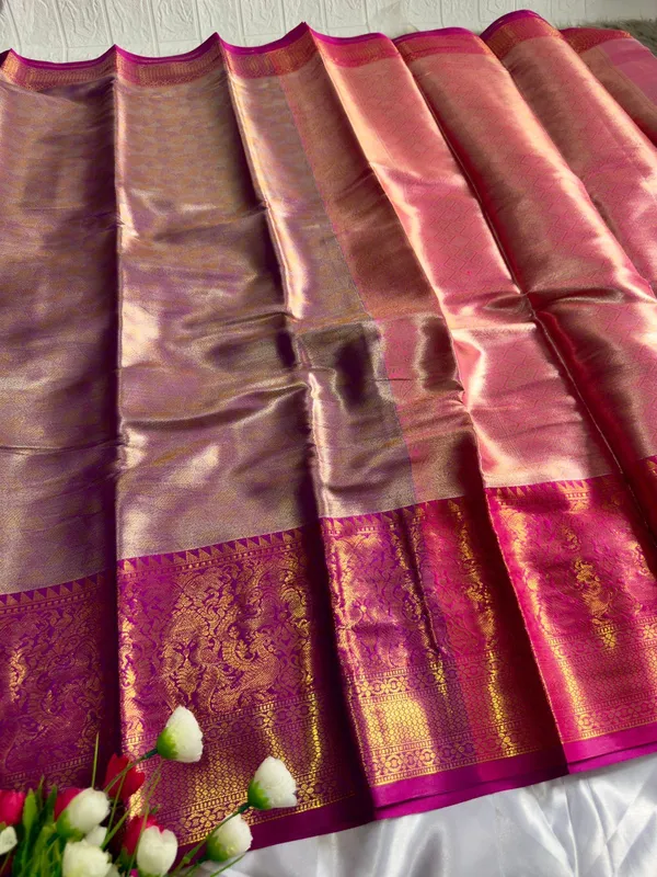 Premium_Pattu_Tissue_Silk_Saree_crafted_with_a_rich_shimmering_finish_and_elegant_woven_texture,_designed_for_graceful_festive_and_wedding_wear._The_saree_features_a_luxurious_soft_drape_with_intricate_detailing_that_enhances_its_royal_appeal._Paired_with_a_matching_blouse_piece_for_a_complete_traditional_look.