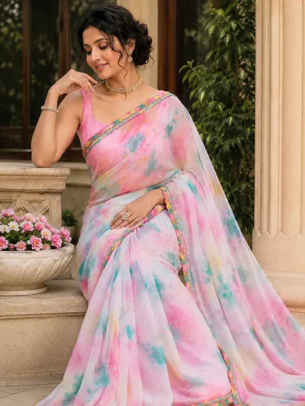 Stay_stylish_and_comfortable_all_day_with_this_beautiful_Georgette_Saree_featuring_an_elegant_multi-color_pattern_and_a_plain_contrast_pink_blouse_piece._Designed_with_a_graceful_lace_border,_this_saree_gives_a_soft,_lightweight_feel_that_makes_it_perfect_for_daily_wear,_office_wear,_casual_outings,_and_small_gatherings.