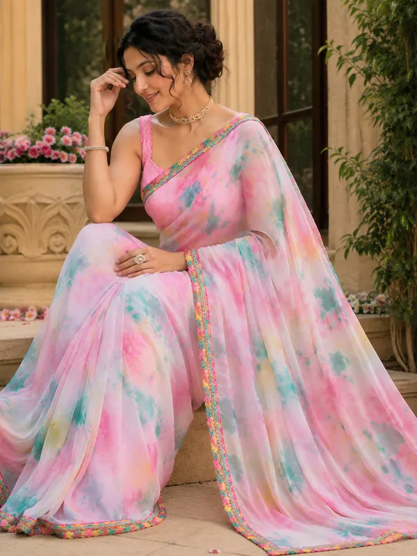 Stay_stylish_and_comfortable_all_day_with_this_beautiful_Georgette_Saree_featuring_an_elegant_multi-color_pattern_and_a_plain_contrast_pink_blouse_piece._Designed_with_a_graceful_lace_border,_this_saree_gives_a_soft,_lightweight_feel_that_makes_it_perfect_for_daily_wear,_office_wear,_casual_outings,_and_small_gatherings.