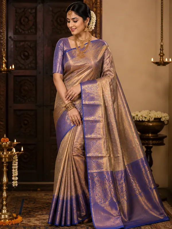 Premium_Pattu_Tissue_Silk_Saree_crafted_with_a_rich_shimmering_finish_and_elegant_woven_texture,_designed_for_graceful_festive_and_wedding_wear._The_saree_features_a_luxurious_soft_drape_with_intricate_detailing_that_enhances_its_royal_appeal._Paired_with_a_matching_blouse_piece_for_a_complete_traditional_look.