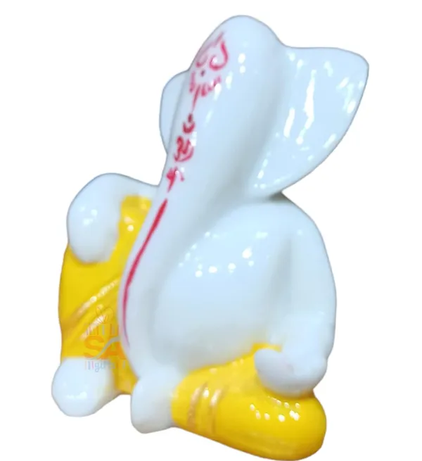 Tilak_Ganesh_Idol_for_Car_Dashboard,_Small_Marble_Idol_God_Ganesha_Statue_Murti_Ganpati_Idol_Figurine_(Yellow_and_White)