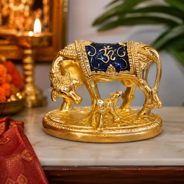 Kamdhenu_Cow_with_Calf_Idol_–_Gold_Finish_Decorative_Showpiece_with_Om_Design_|_Vastu,_Pooja_&_Home_Decor_|_14_x_5_x_11_cm