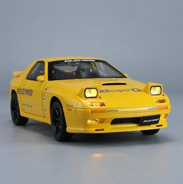 Toyshimmer_die_cast_Metal_Mazda_RX7_die_cast_1:24_Scale_Model_with_Iconic_popup_Headlight_with_Light_end_Engine_Sound_Music_for_Boys_and_Adults._(Yellow)