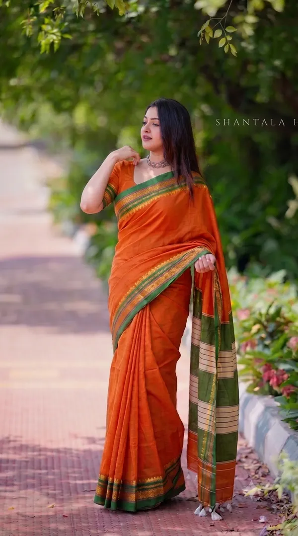 Traditional_Cotton-Blend_Saree_with_Striped_Pallu_and_Tassels_-_Rust_Orange_&_Green