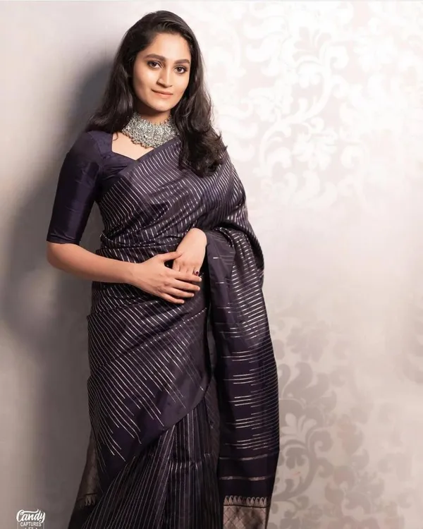 Elegant_Black_Designer_Saree_with_Metallic_Stripe_Pattern