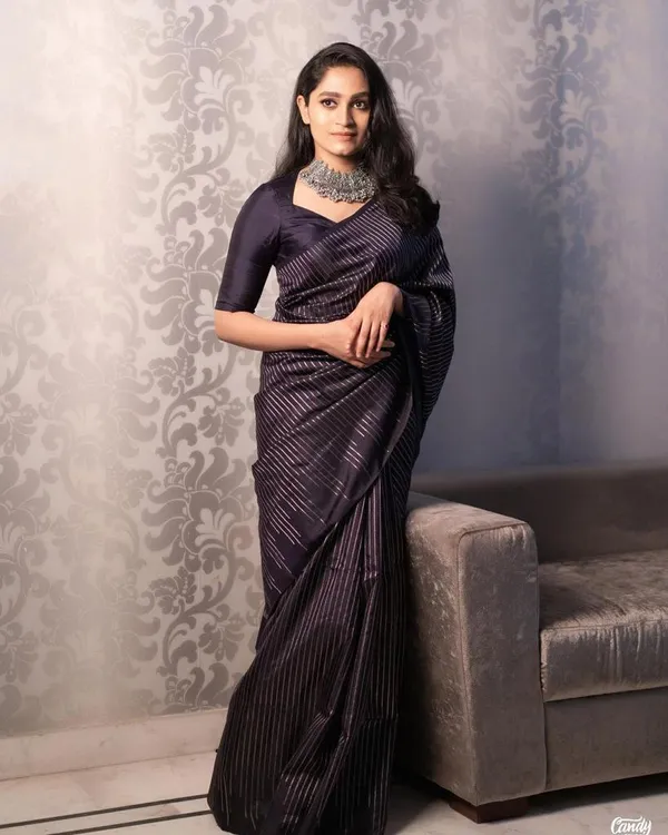 Elegant_Black_Designer_Saree_with_Metallic_Stripe_Pattern