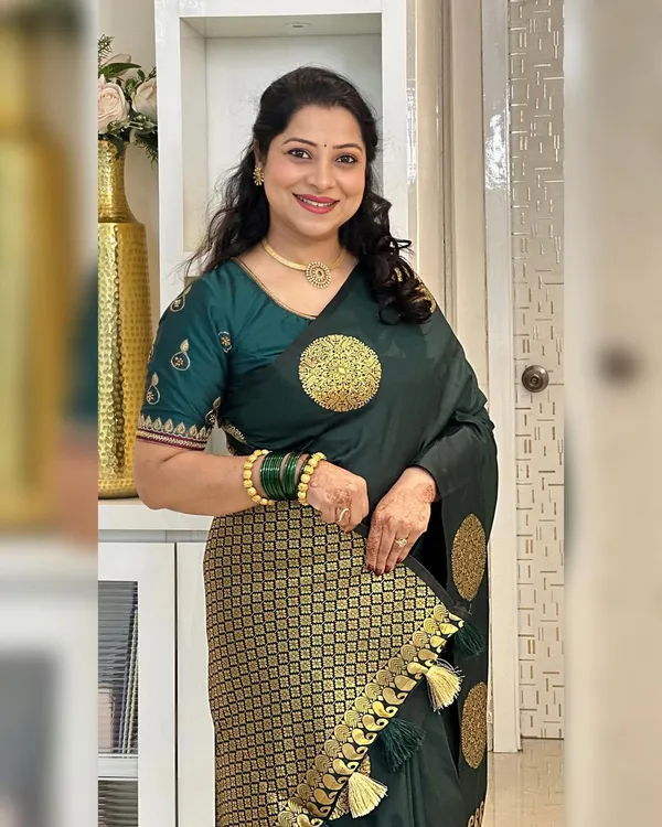 Elegant_Dark_Green_Silk_Saree_with_Golden_Polka_Zari_Design