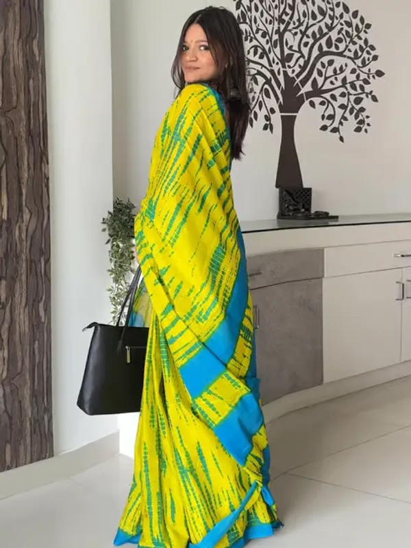 Vasudha_Pure_Cotton_Saree_–_Elegant_Teal_Blue_with_Ethnic_Border