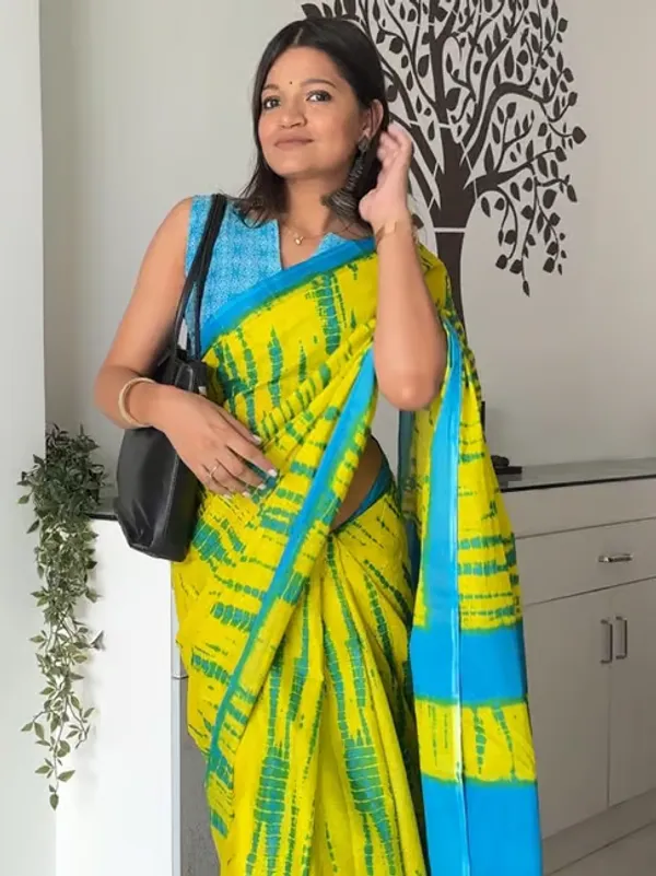 Vasudha_Pure_Cotton_Saree_–_Elegant_Teal_Blue_with_Ethnic_Border