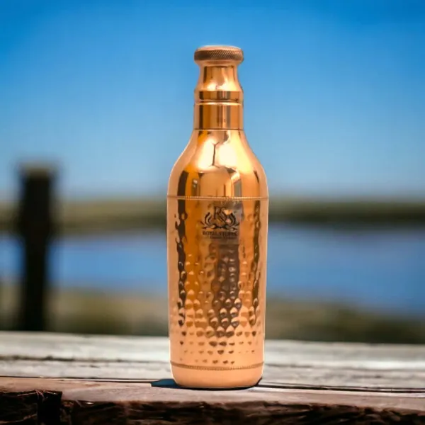 Royalstuffs_Handcrafted_Copper_Water_Bottle_1200_Ml_Hammered_Polish_Water_Bottle_Leak_Proof_Copper_Bottle_Champagne_Shape_For_Water