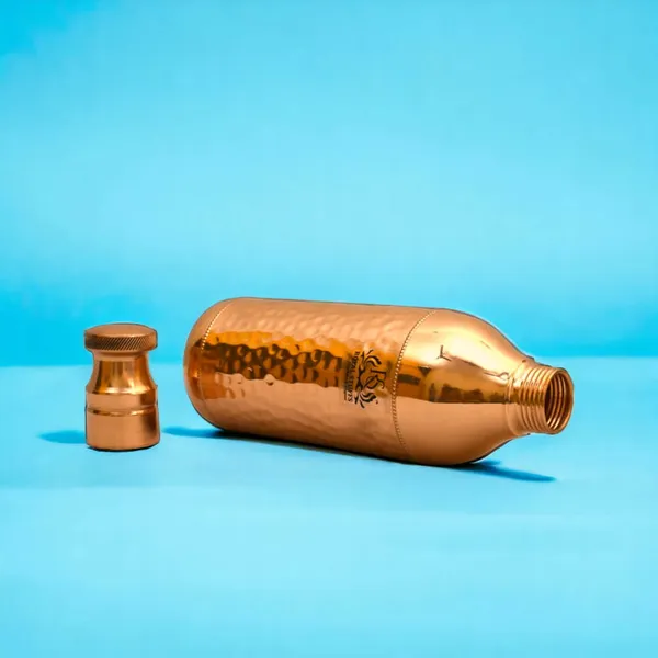 Royalstuffs_Handcrafted_Copper_Water_Bottle_1200_Ml_Hammered_Polish_Water_Bottle_Leak_Proof_Copper_Bottle_Champagne_Shape_For_Water