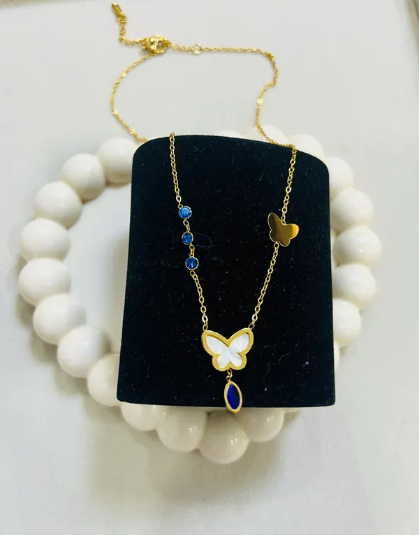 Golden_Butterfly_Charm_Necklace_With_Blue_Stones_For_Women