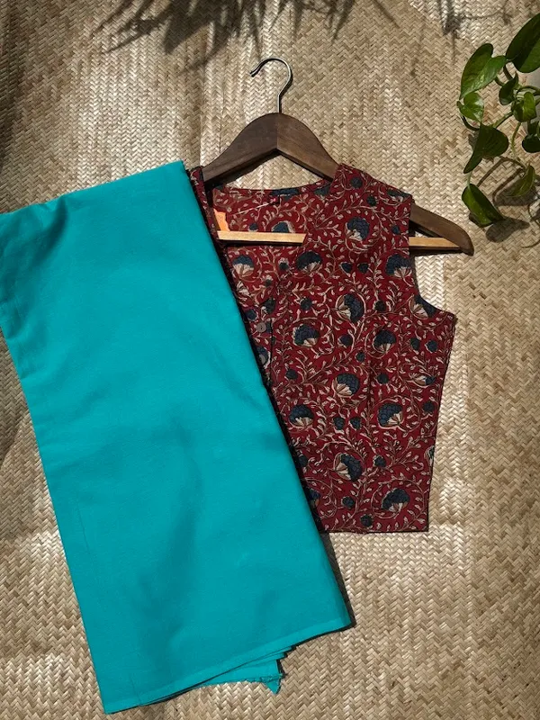 Aqua_Teal_Plain_Mulmul_Saree_with_Fabric_Tassels
