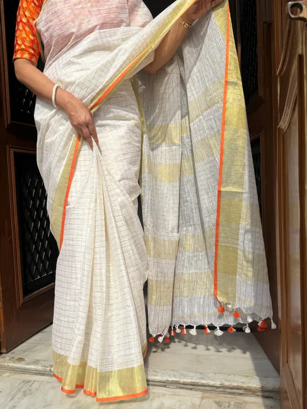 The_Onam_Aurora:_Off-White_Zari_Linen_Saree_with_Sunset_Orange_Blouse