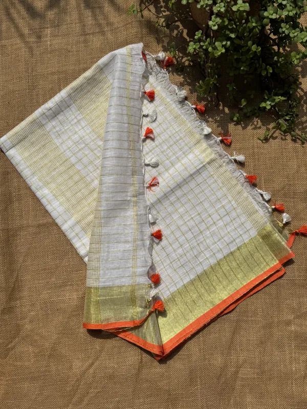 The_Onam_Aurora:_Off-White_Zari_Linen_Saree_with_Sunset_Orange_Blouse