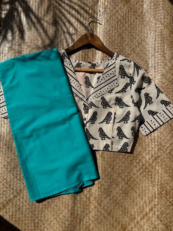 Aqua_Teal_Plain_Mulmul_Saree_with_Fabric_Tassels