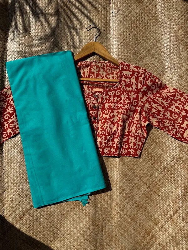 Aqua_Teal_Plain_Mulmul_Saree_with_Fabric_Tassels