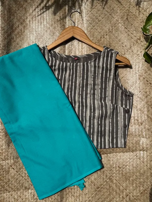 Aqua_Teal_Plain_Mulmul_Saree_with_Fabric_Tassels