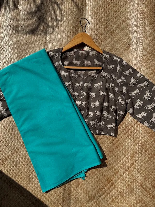 Aqua_Teal_Plain_Mulmul_Saree_with_Fabric_Tassels