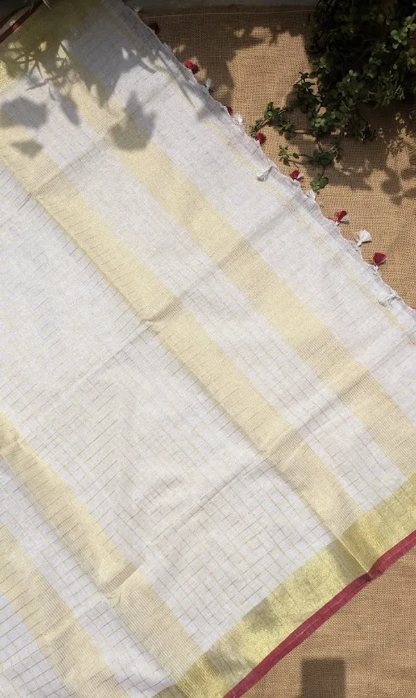 The_Onam_Aurora:_Off-White_Zari_Linen_Saree_with_Sunset_Orange_Blouse