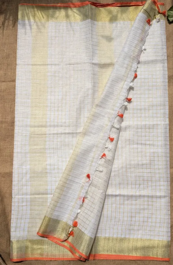 The_Onam_Aurora:_Off-White_Zari_Linen_Saree_with_Sunset_Orange_Blouse