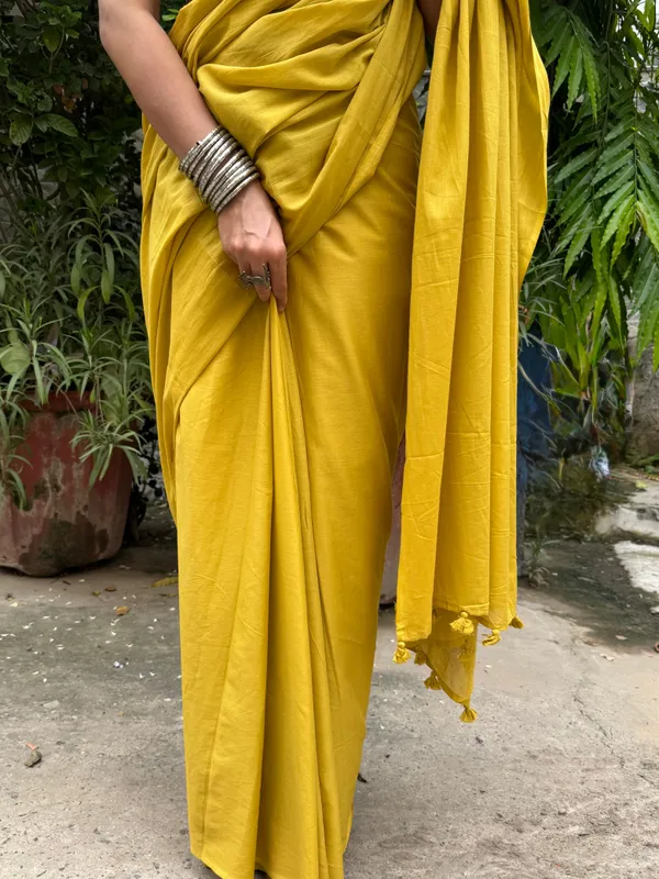 Mustard_Sun_Plain_Mulmul_Saree_with_Fabric_Tassels