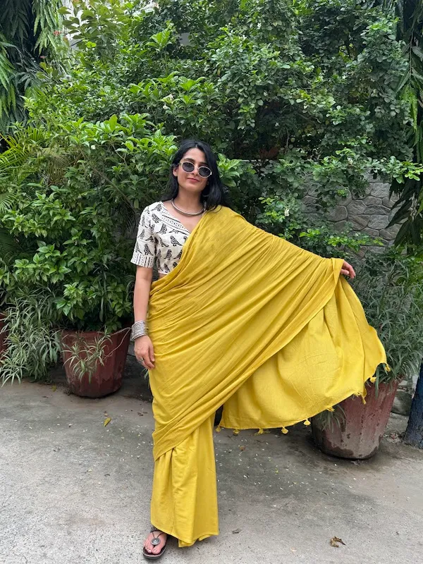 Mustard_Sun_Plain_Mulmul_Saree_with_Fabric_Tassels