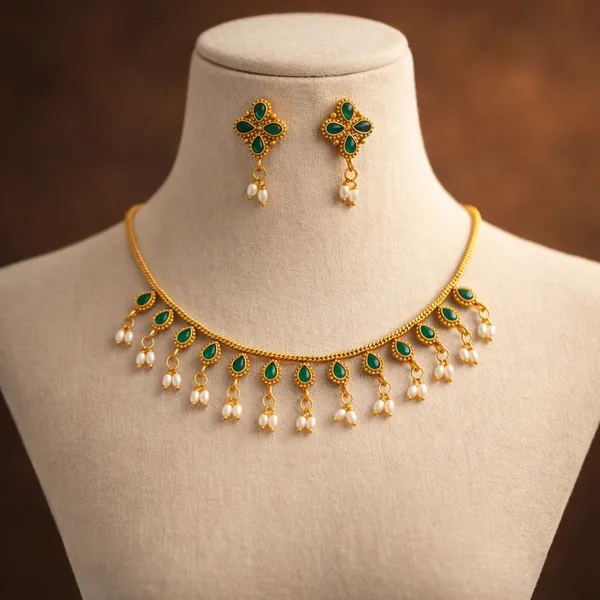 Viva_Jewels_Regal_Gold-Plated_Emerald_Green_Stone_Choker_Set_–_Classic_Traditional_Choker_with_Vibrant_Synthetic_Stones,_Guttapusalu_Pearl_Hangings,_and_Matching_Earrings