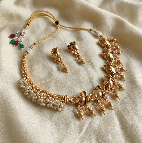 Viva_Jewels_Divine_Antique_Gold_Asymmetric_Elephant_Choker_Set_–_Half-Pearl_Mesh_Collar_with_Sequential_Motif_Pendant_and_Drop_Earrings