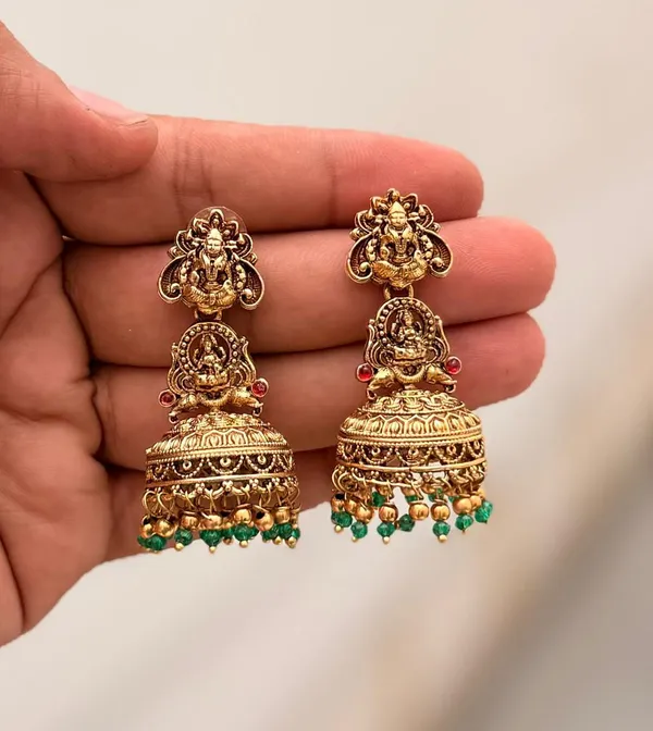 Viva_Jewels_Divine_Lakshmi_Temple_Jhumkas_–_Gold-Plated_Statement_Earrings_with_Traditional_Deity_Motif,_Ruby_Accents,_and_Emerald-Green_Bead_Fringe