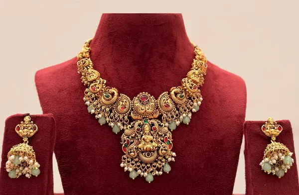 Viva_Jewels_Grand_Antique_Gold-Plated_Goddess_Lakshmi_Temple_Haram_Set_–_Heritage_Peacock_&_Floral_Motif_Choker_with_Traditional_Jhumkas,_Ruby-Emerald_Accents_&_Mint_Green_Bead_Drops