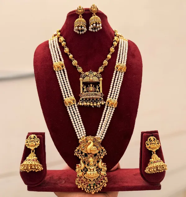 Viva_Jewels_Imperial_Temple_Bridal_Ensemble_–_Multi-Strand_Pearl_Long_Haram_with_Grand_Lakshmi_Pendant,_Matching_Heritage_Choker,_and_Bell_Jhumkas