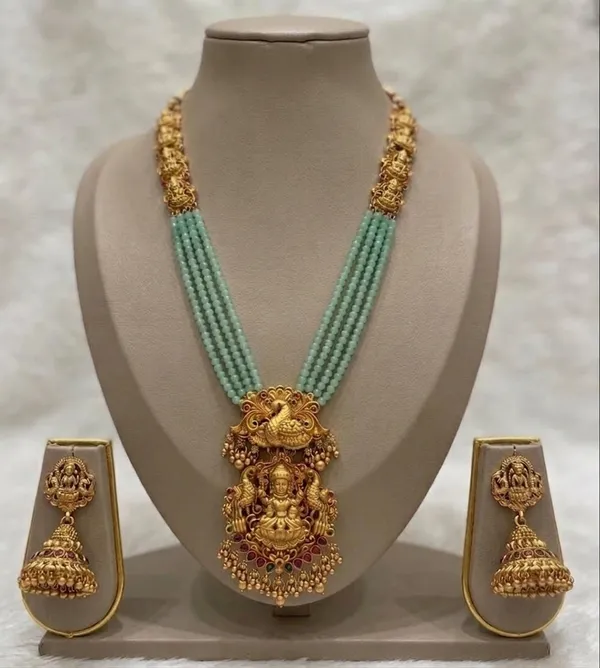 Viva_Jewels_Divine_Lakshmi_&_Peacock_Temple_Haram_Set_–_4-Strand_Mint_Green_Micro-Bead_Mala_with_Antique_Matte_Gold_Pendant_and_Jhumkas
