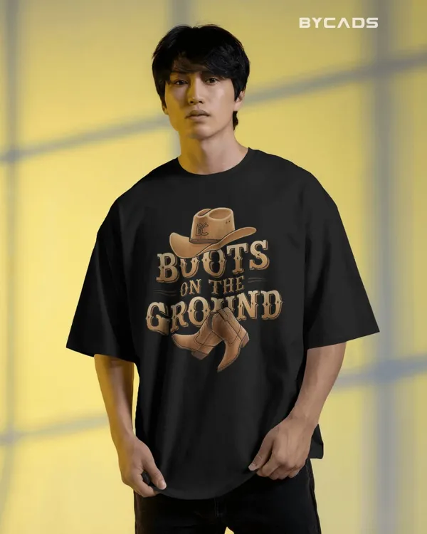 Black_Cotton_Boots_On_The_Ground_Oversized_Unisex_T-Shirt_|_Western_Graphic_Tee