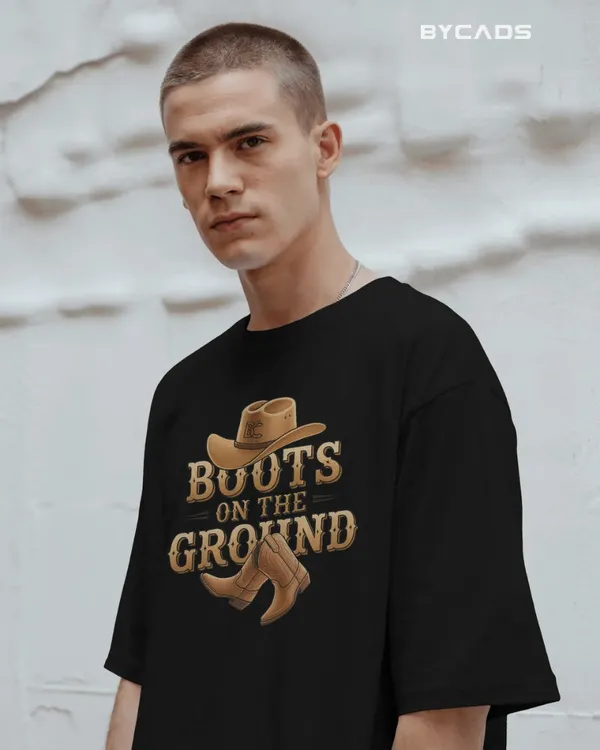 Black_Cotton_Boots_On_The_Ground_Oversized_Unisex_T-Shirt_|_Western_Graphic_Tee