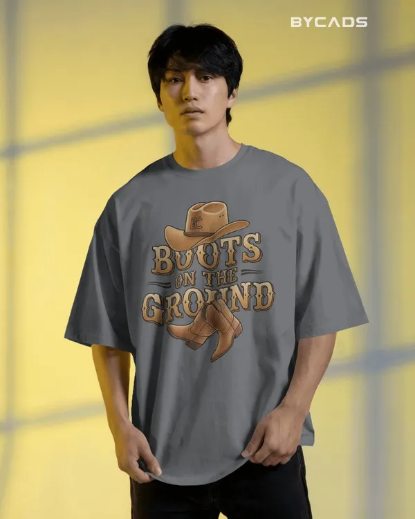 Grey_Cotton_Boots_On_The_Ground_Oversized_Unisex_T-Shirt_|_Western_Graphic_Tee