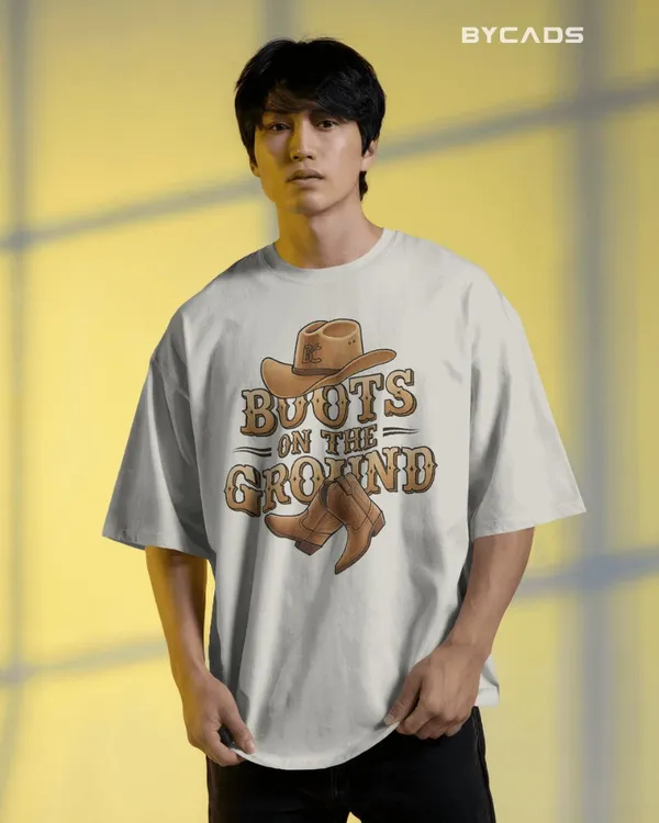 White_Cotton_Boots_On_The_Ground_Oversized_Unisex_T-Shirt_|_Western_Graphic_Tee