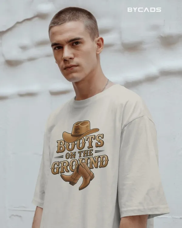 White_Cotton_Boots_On_The_Ground_Oversized_Unisex_T-Shirt_|_Western_Graphic_Tee