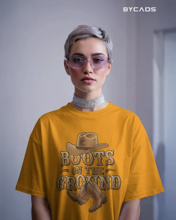 Yellow_Cotton_Boots_On_The_Ground_Oversized_Unisex_T-Shirt_|_Western_Graphic_Tee