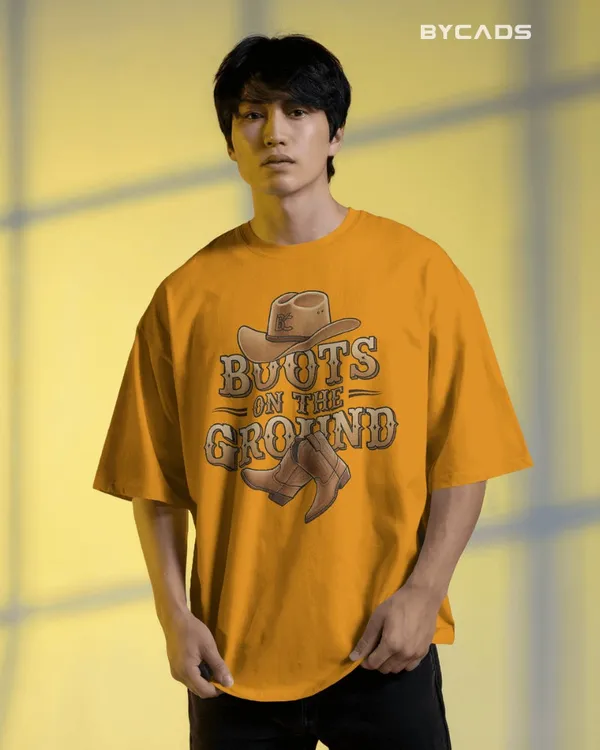 Yellow_Cotton_Boots_On_The_Ground_Oversized_Unisex_T-Shirt_|_Western_Graphic_Tee