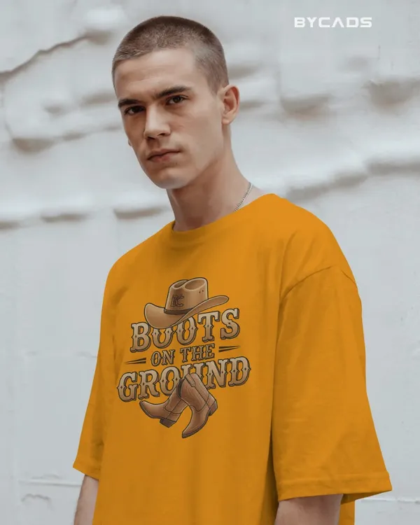 Yellow_Cotton_Boots_On_The_Ground_Oversized_Unisex_T-Shirt_|_Western_Graphic_Tee